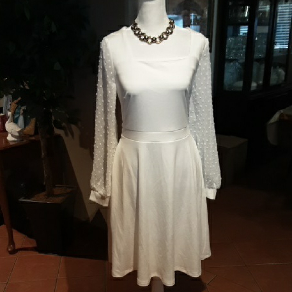 Chic White Dress with Polka Dot Sleeves